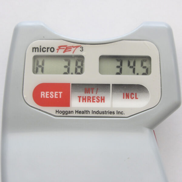 A digital timer and microFET®3 are shown on a white surface.